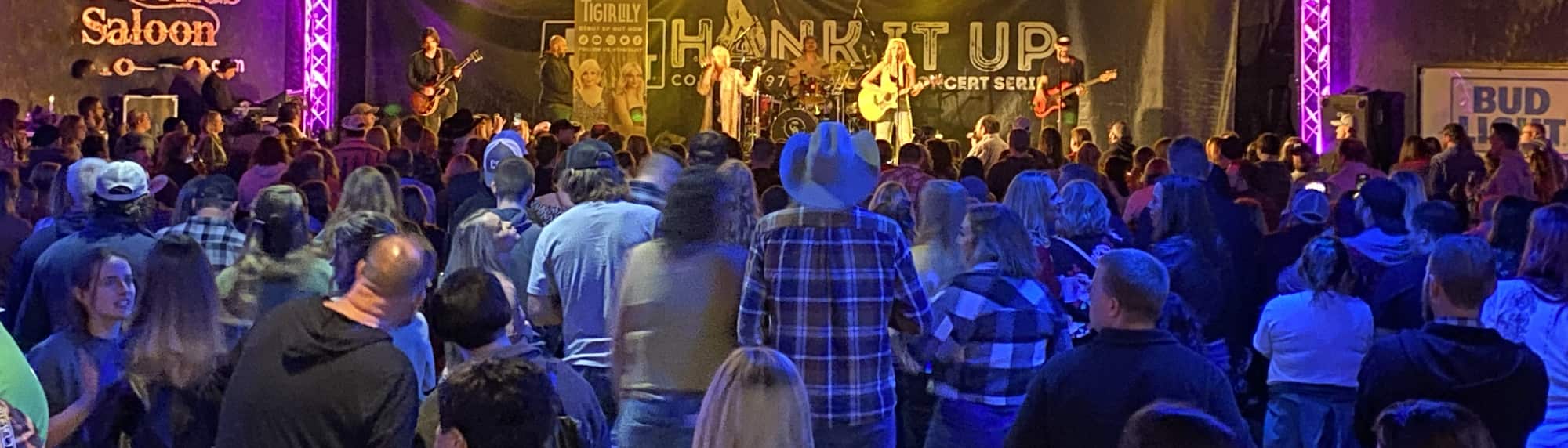 country concert with fans wearing cowboy hats Sarasota