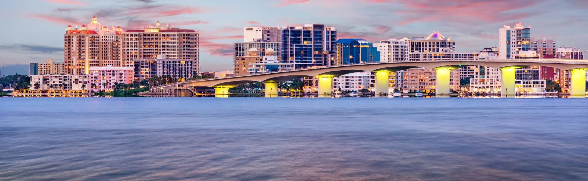 Neon color image of a band playing and people singing along